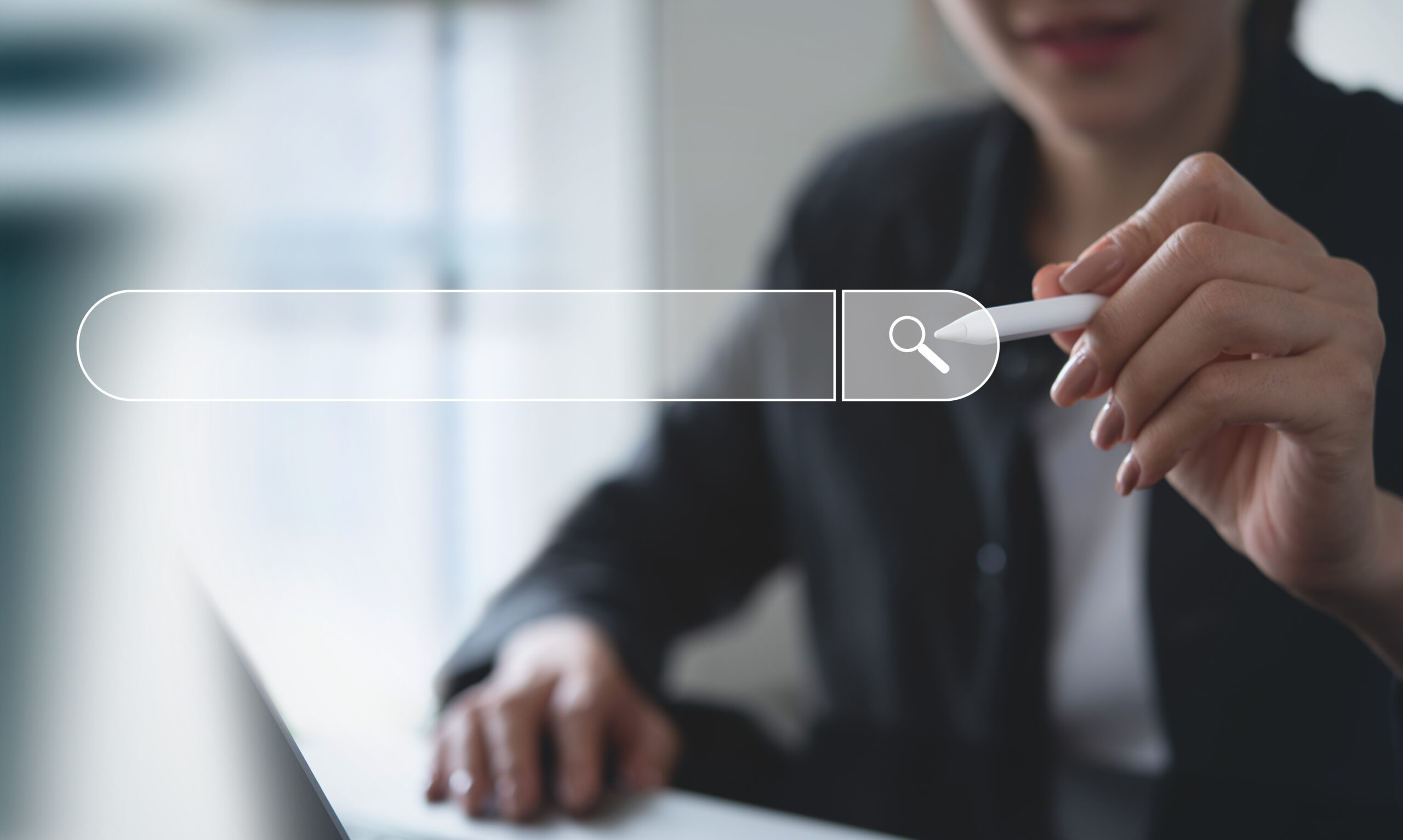 SEO, Search Engine Optimization. Woman touching search bar on virtual screen, working on laptop computer searching the information, internet browsing. Web page banner AdobeStock 811662723 scaled